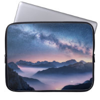 Milky Way over mountains in fog at night in summer