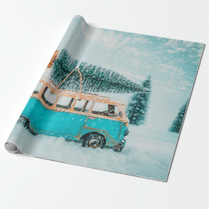 Miniature antique car carrying christmas tree on r wrapping paper
