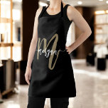 Minimal Black Gold Modern Typographic Monogram Apron<br><div class="desc">Cook in style with the Minimal Black and Gold Modern Typographic Monogram Apron. Featuring a sleek black design with a bold gold typographic monogram, this apron combines modern elegance with practicality. Perfect for cooking, baking, or grilling, it provides full coverage and comfort while you work in the kitchen. The personalised...</div>