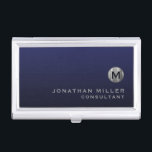 Minimal Luxury Navy Blue Silver Monogram Business Card Holder<br><div class="desc">Minimalist monogram design with brushed metallic silver monogram medallion with personalised name and title or custom text below in classic block typography on a gradient background in shades of navy blue. Personalise for your custom use.</div>