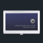 Minimal Luxury Navy Blue Silver Monogram Business Card Holder<br><div class="desc">Minimalist monogram design with brushed metallic silver monogram medallion with personalised name and title or custom text below in classic block typography on a gradient background in shades of navy blue. Personalise for your custom use.</div>