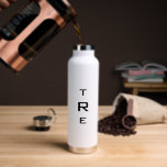 Minimal Monogram on White Water Bottle<br><div class="desc">Minimal,  bold black vertical monogram on white features a larger initial in the centre. Replace the 3 initials with your own in the sidebar.

Other water bottle colours and styles available in the sidebar.

Copyright © Claire E. Skinner. All rights reserved.</div>