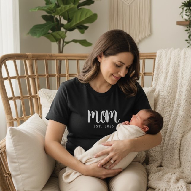 Minimal Mum Established Date New Mum T-Shirt (modern black and white mom custom established date tshirt on new mama holding her baby in boho room)