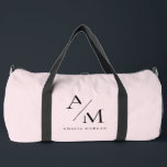 Minimal Pastel Pink Initial & Personalised  Duffle Bag<br><div class="desc">Travel in style with this Minimal Pastel Pink Initial & Personalised Duffle Bag. Featuring a sleek and minimalist design, this duffle bag is perfect for weekend getaways, gym sessions, or daily commutes. The soft pastel pink background adds a touch of elegance and femininity, while the personalised initial or name makes...</div>
