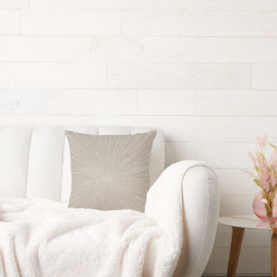 Minimal starburst designs in a neutral palette cushion