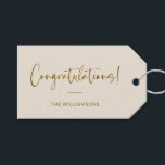 Minimalist Beige Personalised Congratulations Gift Tags<br><div class="desc">A sophisticated and timeless gift tag featuring a soft cream background with elegant script and modern typography in warm gold. Perfect for adding a personalised touch to wedding gifts,  baby showers,  graduations,  or any celebratory occasion. Customise with your family name or message for a stylish and thoughtful finishing touch.</div>