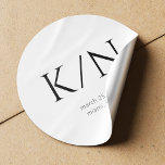 Minimalist black and white monogrammed wedding  classic round sticker<br><div class="desc">Simple minimal modern bold typography monogram bride and groom initials,  custom date and place wedding sticker. Suitable to be used as an invitation envelope seal or as a favour label.</div>