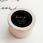 Minimalist | Black Thank You Wedding Favour Sticke Classic Round Sticker<br><div class="desc">These minimalist black thank you wedding favour stickers are perfect for a simple wedding reception. The modern romantic design features classic black and white typography paired with a rustic yet elegant calligraphy with vintage hand lettered style. Customisable in any colour. Keep the design simple and elegant, as is, or personalise...</div>