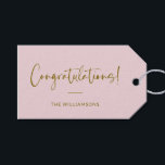 Minimalist Blush Pink Personalised Congratulations Gift Tags<br><div class="desc">A stylish and elegant gift tag featuring a soft blush pink background with flowing script and modern typography in warm gold. Perfect for adding a personal touch to wedding gifts, baby showers, graduations, or any celebratory occasion. Customise with your family name or message for a unique and thoughtful finishing touch....</div>