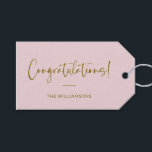 Minimalist Blush Pink Personalised Congratulations Gift Tags<br><div class="desc">A stylish and elegant gift tag featuring a soft blush pink background with flowing script and modern typography in warm gold. Perfect for adding a personal touch to wedding gifts, baby showers, graduations, or any celebratory occasion. Customise with your family name or message for a unique and thoughtful finishing touch....</div>