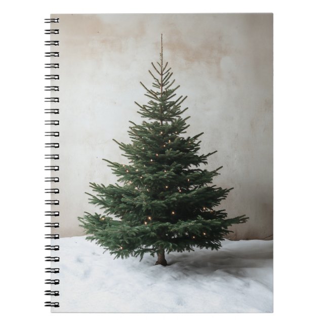 Minimalist Christmas Tree with Soft Lights on Snow Notebook (Front)