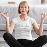 Minimalist Grandma EST 2025 Custom Gift T-Shirt<br><div class="desc">Celebrate a beautiful new role with this Minimalist Grandma EST 2025 custom T-shirt — the perfect gift for soon-to-be or first-time grandmothers. Featuring sleek, elegant typography on a soft, comfortable tee, this design is ideal for baby announcements, Mother’s Day, pregnancy reveals, or everyday wear. Add the personalised year to mark...</div>