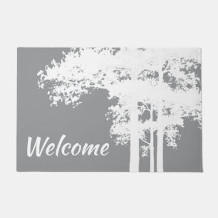 Minimalist grey and white tree silhouettes doormat