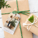 Minimalist Merry Christmas Photo Gift Tags<br><div class="desc">This minimalist modern holiday gift tag features one large of your favourite personal photo layout on top of the card. The festive red and white tag design says "Merry Christmas" in elegant,  trendy handwritten script calligraphy typography,  and family name in a classic san serif font.</div>