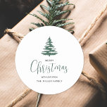 Minimalist Merry Christmas Tree Personalised Classic Round Sticker<br><div class="desc">Minimalist Green and white script handwritten Merry Christmas holiday Tree Classic Round Sticker. These stickers can be personalised with your own name. Perfect for gift labels and mailing stickers.</div>