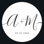 Minimalist Monogram Script Custom Wedding date Classic Round Sticker<br><div class="desc">Elevate your wedding details with the Minimalist Monogram Script Custom Wedding Date Sticker. This elegant and personalised sticker adds a touch of sophistication to your wedding stationery, allowing you to showcase your monogram and wedding date in a simple yet impactful way. The sticker features a minimalist script design that exudes...</div>