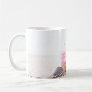 Minimalist photography of pineapple near sandals a coffee mug
