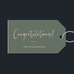 Minimalist Pink Dark Green Custom Congratulations Gift Tags<br><div class="desc">A sophisticated and timeless gift tag featuring a dark sage green background with elegant script and modern typography in pink. Perfect for adding a personalised touch to wedding gifts,  baby showers,  graduations,  or any celebratory occasion. Customise with your family name or message for a stylish and thoughtful finishing touch.</div>