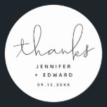 Minimalist Simple Script Thanks Wedding Classic Round Sticker<br><div class="desc">Modern wedding favour sticker featuring a hand lettered script that says "thanks" in black and white. Customise this product by adding the couple's names and event date.</div>
