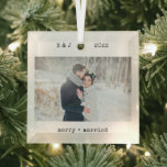 Minimalist Typewriter | Merry and Married Photo Glass Tree Decoration<br><div class="desc">These simple and minimalist Christmas holiday glass ornaments feature your favourite wedding photo along with your initials,  the year,  and the words "merry and married" in black typewriter look text. A stylish,  vintage and nostalgic look keepsake for your first Christmas as husband and wife.</div>