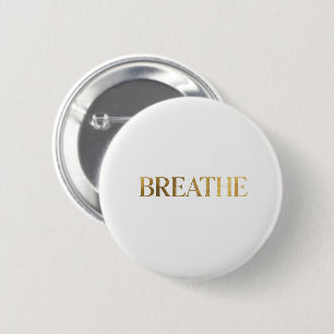 Minimalist typography with gold word breathe 6 cm round badge