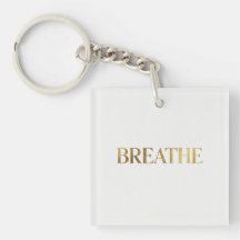 Minimalist typography with gold word breathe