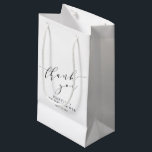 Minimalist White Black Bridal Shower Thank You Small Gift Bag<br><div class="desc">Make your bridal shower or special event extra memorable with this stylish personalised gift bag. Featuring a minimalist "thank you" in elegant script, this design blends modern sophistication with timeless charm. Perfect for bridal party gifts, wedding favours, or special thank-you treats, this customisable bag adds a thoughtful touch to any...</div>