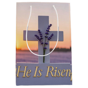 Minimalist white cross adorned with lavender medium gift bag