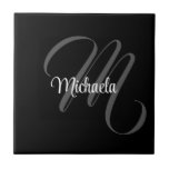 Minimalistic modern monogram initial name ceramic tile<br><div class="desc">Minimalistic modern monogram initial name black white. Personalizable custom name with a cursive initial behind on a black colour.</div>