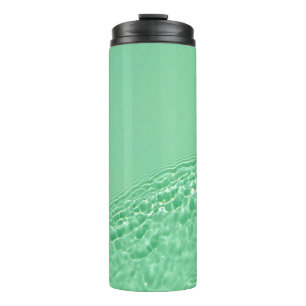 Mint blue coloured clear water surface texture wit thermal tumbler