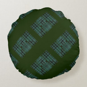 Mint button or pit on forest green, forming shapes round cushion