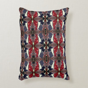 Mirror image generating repeated shape, over white decorative cushion