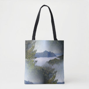 Misting fog over the mountains... tote bag