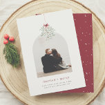 Mistletoe Magic | Minimalist Arch Photo Christmas Holiday Card<br><div class="desc">A modern and minimalist couple's Christmas holiday card design. The front of this card features a bundle of watercolor mistletoe greenery, wrapped in a bow. Underneath the mistletoe, there is a custom photo of your choice in a boho, modern arch shape. Perfect for couples and newlyweds. Below the photo, you'll...</div>