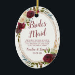 Mistletoe Manor Watercolor To the Bridesmaid Quote Ceramic Ornament<br><div class="desc">Mistletoe Manor Watercolor Lush Roses Design with Hand Painted Florals, Holly Berry Leaves, Pine Sprig Foliage, and Watercolor Paint Brush Strokes. Colourful Marsala, Wine Merlot Red, Burgundy, Ivory Cream, and Green. With Swirly Chic Typography Brush Script Fonts and Rose Gold Elegant Floral Oval Frame - Bridesmaid Heartfelt Quote Keepsake Ornament!...</div>