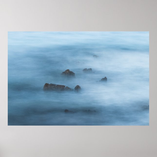 Misty blue long exposure of rocks in sea poster (Front)