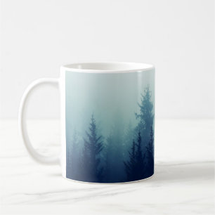 Misty fog in pine forest on mountain slopes. Color Coffee Mug