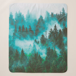 Misty foggy mountain landscape with fir forest and sherpa blanket
