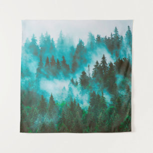 Misty foggy mountain landscape with fir forest and tapestry