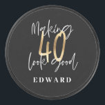 Modern black and gold typography 40th birthday hockey puck<br><div class="desc">Modern black and gold typography 40th birthday  gift. Part of a elegant stylish collection.</div>