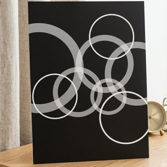 Modern black and white overlapping circles poster (This modern black and white circular wall poster adds a sharp, artistic touch to any home office.)