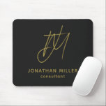 Modern Black Gold Monogram Mouse Pad<br><div class="desc">Keep your workspace stylish and functional with this Modern Black Gold Monogram Mouse Pad. The sleek design features a customisable monogram with name and title on a black background, and the non-slip rubber base ensures a secure grip on any surface. Perfect for both personal and professional use, this mouse pad...</div>