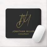 Modern Black Gold Monogram Mouse Pad<br><div class="desc">Keep your workspace stylish and functional with this Modern Black Gold Monogram Mouse Pad. The sleek design features a customisable monogram with name and title on a black background, and the non-slip rubber base ensures a secure grip on any surface. Perfect for both personal and professional use, this mouse pad...</div>
