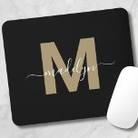 Modern Black Gold Script Name Initial Monogram Mouse Pad<br><div class="desc">Personalised Elegant Modern Black Gold Script Initial Name Monogram Mouse Pad. Add a touch of sophistication to your workspace with this chic mouse pad. It features a flat gold-coloured initial (without shimmer or foil) centred on a sleek black background. The refined design combines elegance with practicality, making it a perfect...</div>