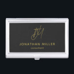 Modern Black Monogram Business Card Holder<br><div class="desc">Keep your business cards organised and stylish with this modern black business card case. The design features a golden monogram, name and title, adding a personal touch to your professional look. This case is perfect for carrying in your bag or briefcase, and makes a great gift for colleagues and clients....</div>