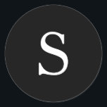 Modern Black Monogram Wedding Classic Round Sticker<br><div class="desc">Modern wedding stickers featuring a simple design with your one initial monogram in a white serif font over a black background. The background and font colours may be changed to any colours that you wish. A plain and basic design that still comes across as chic and stylish. These minimalist style...</div>