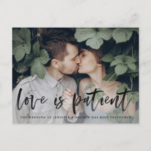 Modern Brush Script Love is Patient Postponement Announcement Postcard