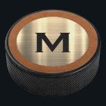 Modern Brushed Gold Luxury Monogram Hockey Puck<br><div class="desc">Modern monogrammed design features a brushed metallic gold monogram medallion on a sable brown textured background with your personalised initial in classic block typography monogram medallion emblem. Personlize with your initial.</div>