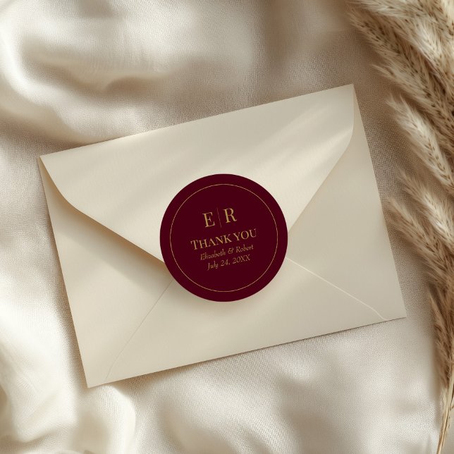 Modern Burgundy Monogram Wedding Thank You Classic Round Sticker (Modern Burgundy Monogram Wedding Thank You Classic Round Sticker on a wedding envelope)
