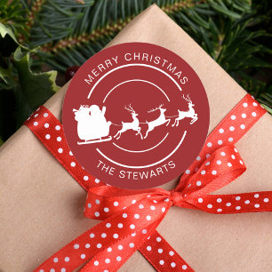 Modern Christmas Santa and Reindeer Family Name Classic Round Sticker